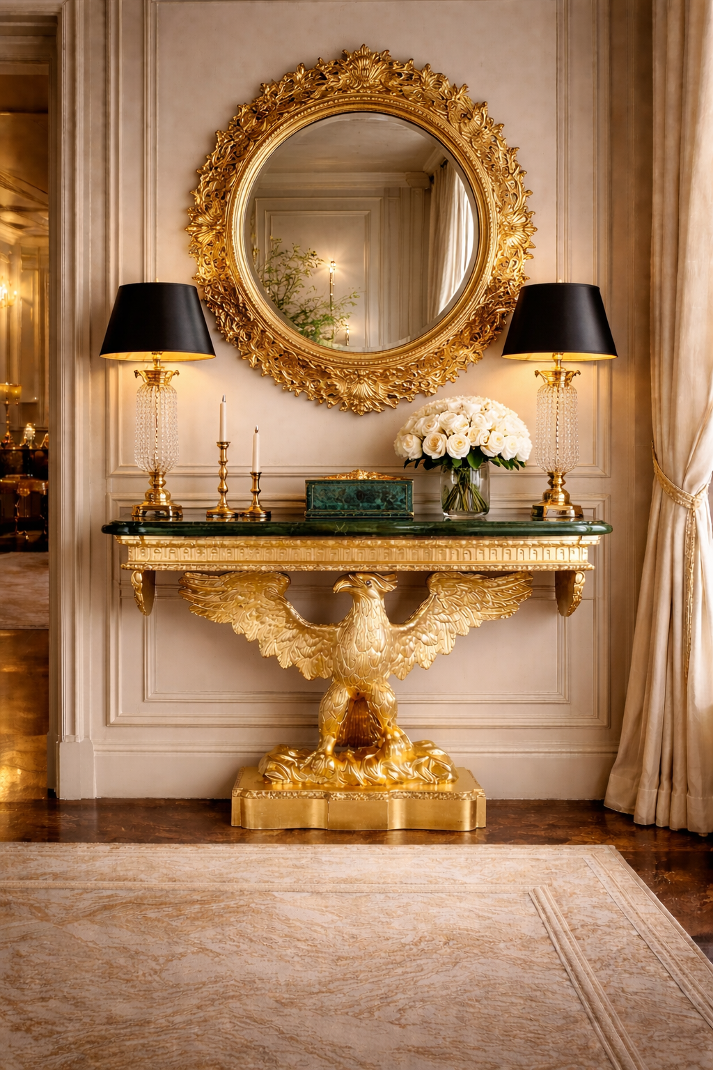 Decorative console table with gold eagle design, mirror, and lamps in an elegant room.