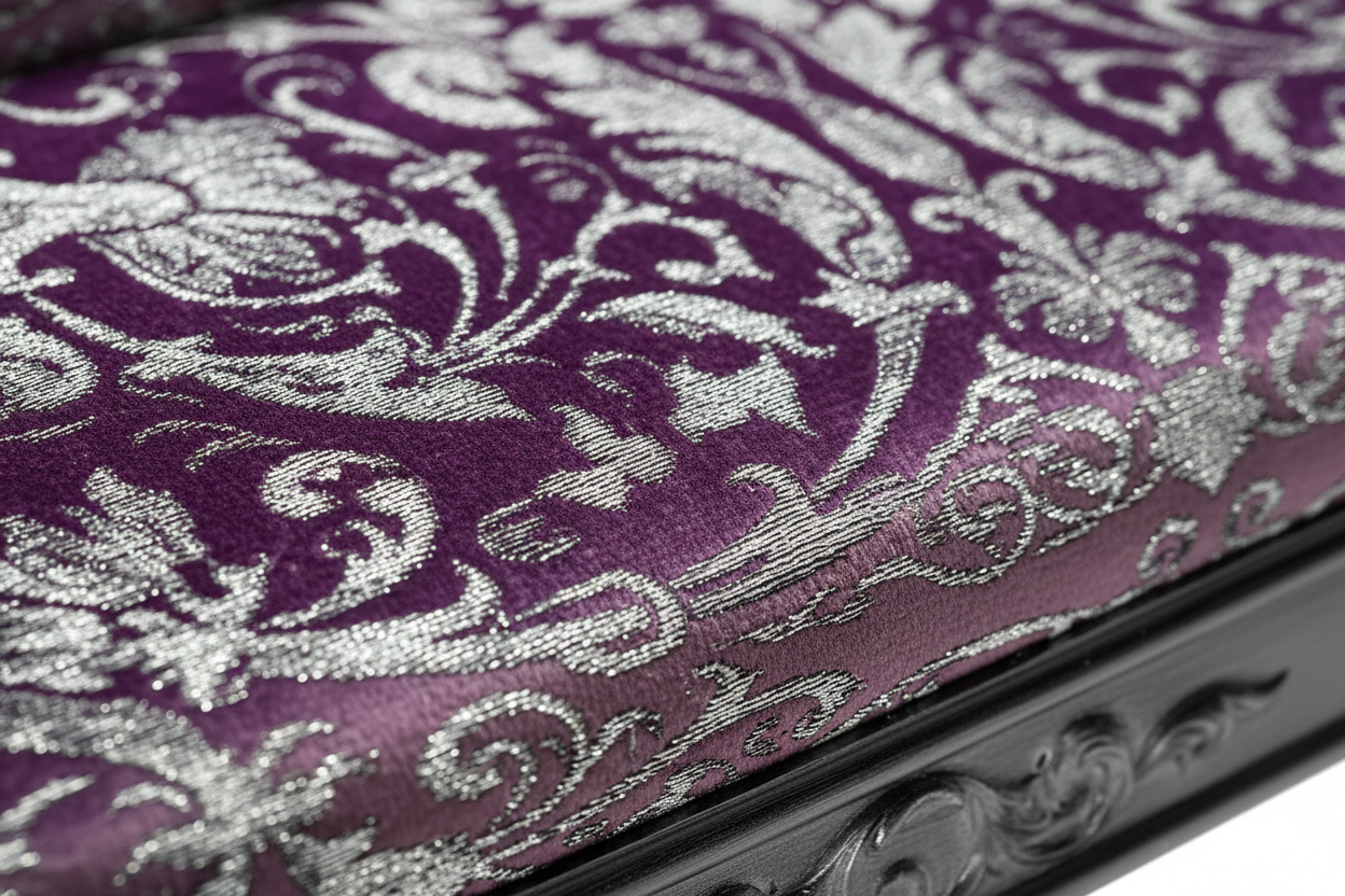 Macro detail of Versace Violet Baroque velvet fabric with deep violet, purple and silver baroque pattern on the Vanitas loveseat