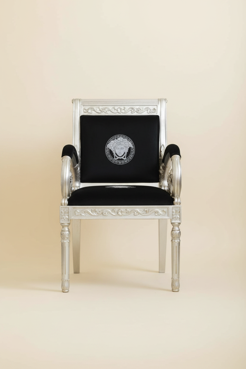 Full front-facing hero shot of the Luxury Custom Vanitas Armchair with Silver Leaf finish and black velvet with silver Medusa Greek Key embroidery against a clean soft luxury background