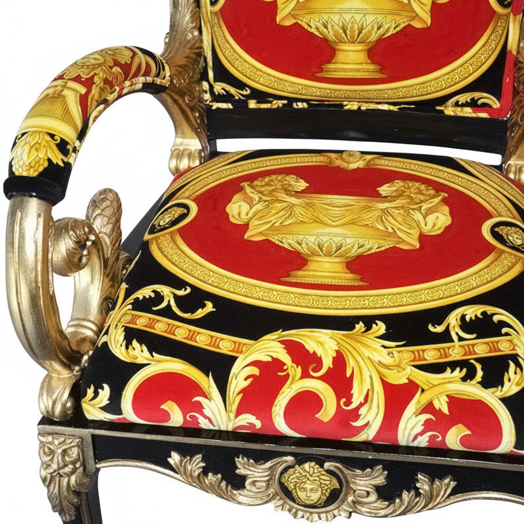 Enhanced detail shot of the front seat of the Luxury Custom Vanitas Armchair showing the Versace Red Double Lion velvet fabric pattern